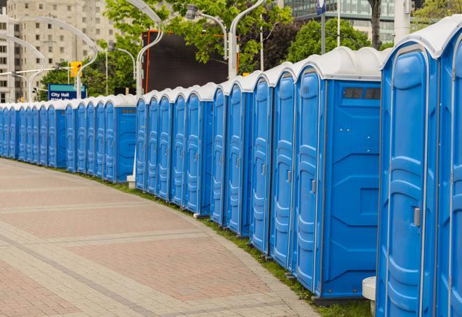 hygienic portable restrooms lined up at a beach party, ensuring guests have access to the necessary facilities while enjoying the sun and sand in Lancaster